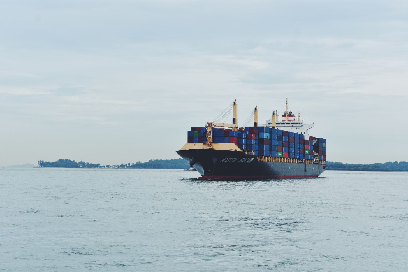 Cargo vessel at sea, monitored by the operations team